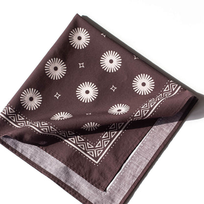 Purple bandana with white geometric pattern on a white background