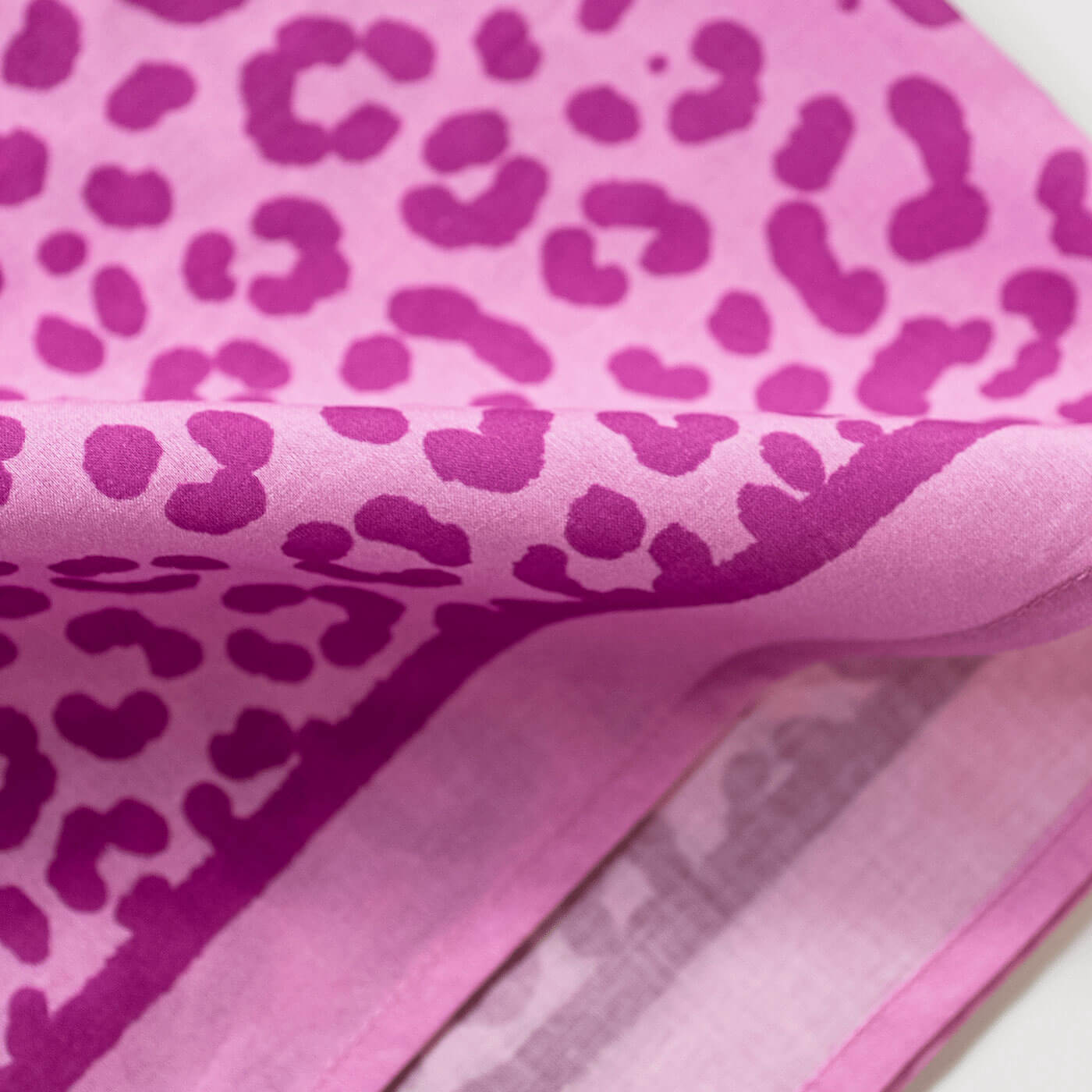 Close-up of pink bandana with leopard print pattern