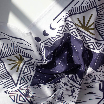 Bandana with abstract patterns including geometric shapes and celestial elements.